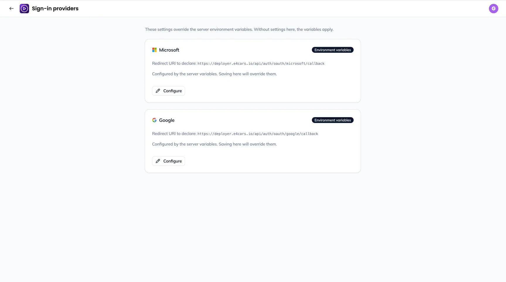 The Sign-in providers screen: a Microsoft card configured here, a Google card configured by environment variables